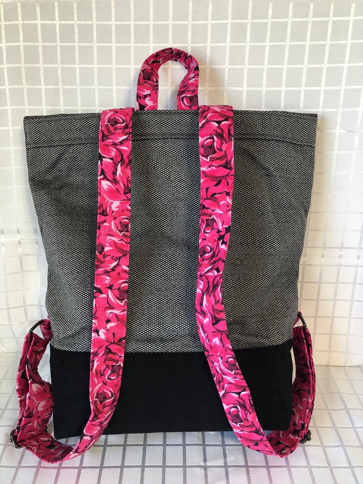 Feminine Back Packs with plenty of roominess on the inside, a pocket inside and out, adjustable straps and a handle for easy carry.